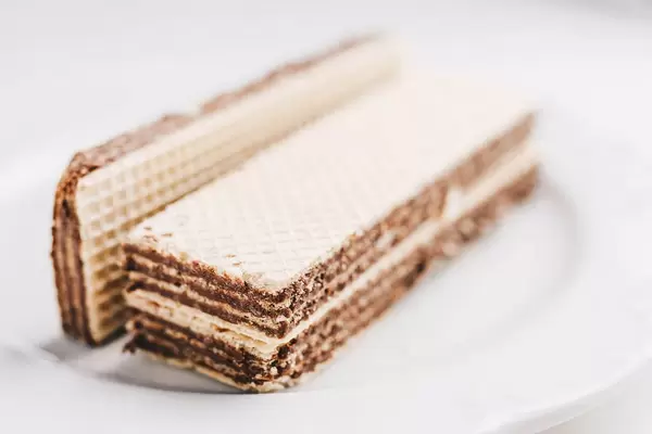 Waffles with chocolate filling on white background. Close up