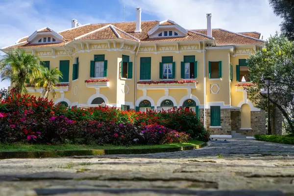Walkway next to a Flower Garden leading to Bao Dai King Palace with French Architecture in Da Lat, Vietnam