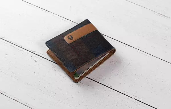 Wallet on white wooden table