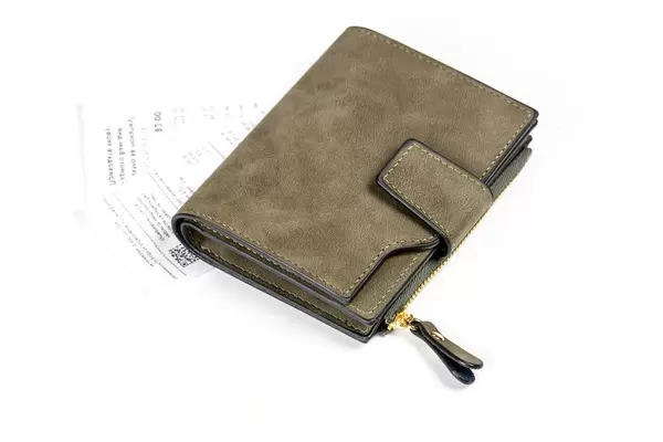 Wallet with receipts on a white background. Concept of monetary expenses, payment (Flip 2020)