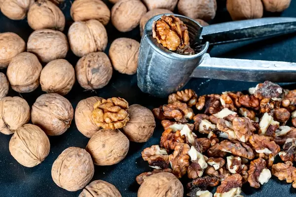 Walnuts, peeled and in a shell with Nutcracker