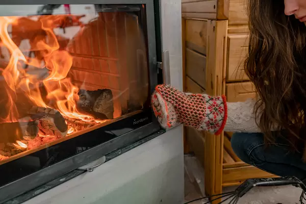 Warming Hands With Mittens On Fireplace - Winter Cozyness
