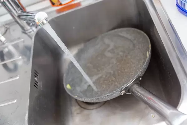 Washing a dirty pan