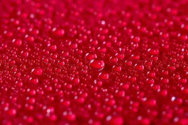 Water drops on red background