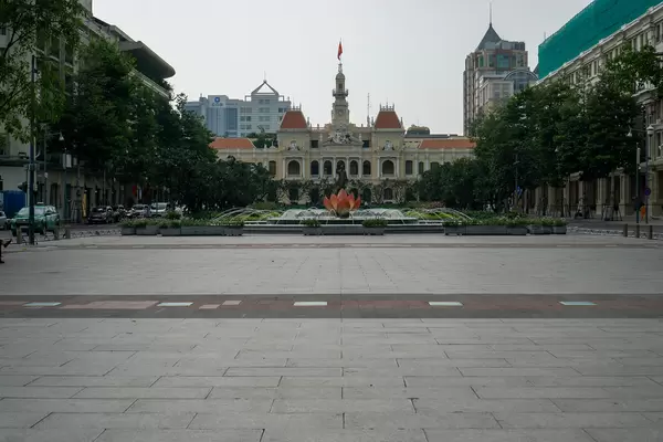 Water Fountain with Giant Pink Lotus Flower on Nguyen Hue Walking Street with People's Committee of Ho Chi Minh City in the Background