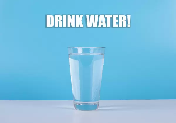 Water glass with Drink Water text