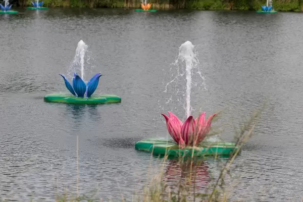 Water lily installations with splashing water at the lake of Tomorrowland