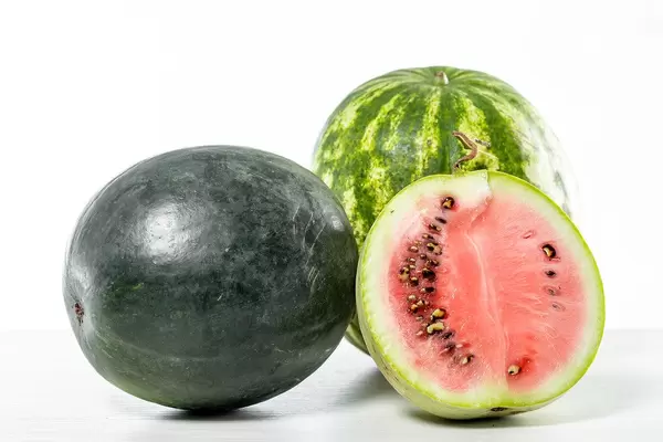Watermelons of different varieties on a white table (Flip 2019)