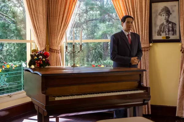 Wax Sculpture of Emperor Bao Dai of Nguyen Dynasty next to a Piano inside the King's Palace in Da Lat, Vietnam