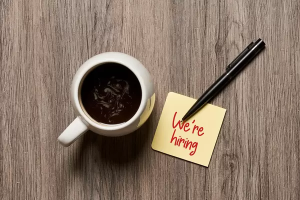 We are hiring on sticky note and coffee mug