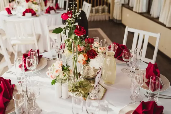 Wedding Decor Table Serving With Red Roses And Red Napkins