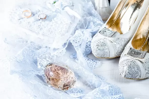 Wedding shoes and perfume bottle