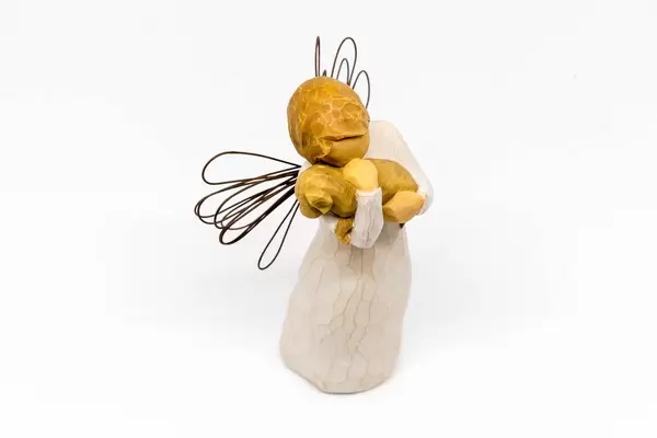 Weihnachtsengel mit Kalb im Arm