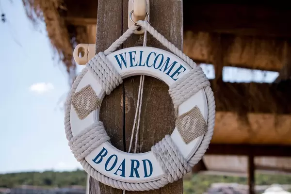 Welcome a board sign on rustic wood, beach bar