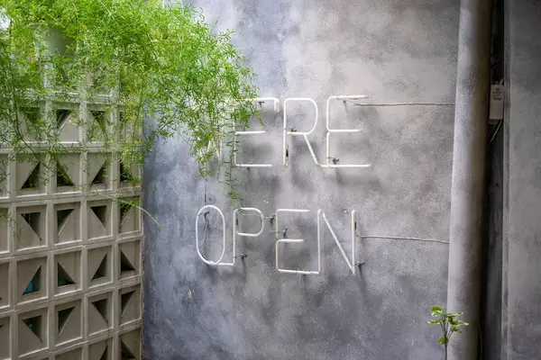We're Open Wall Light Sign at a Cafe Outdoor Area