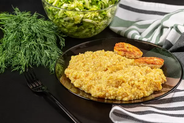Wheat porridge with cutlets and salad
