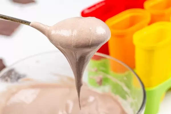Whipped fresh ice cream in a spoon, close-up