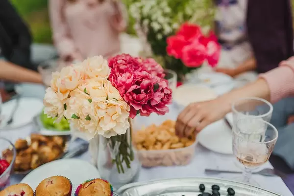 White And Red Peonies On Picnic Table