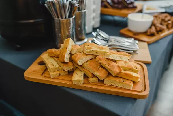 White Bread Slices On A Wooden Board