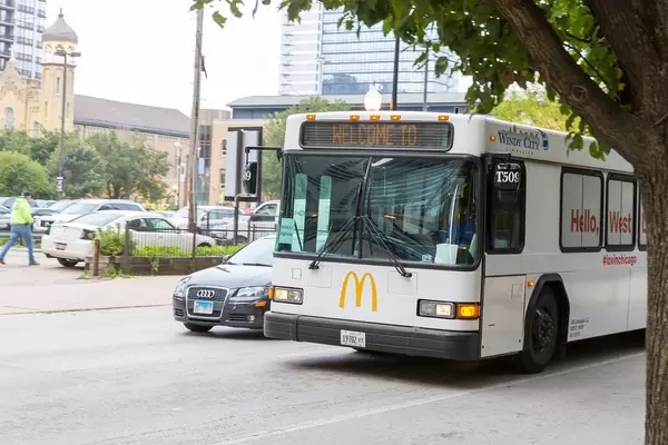 White bus with McDonald's logo on the streets of Chicago, USA