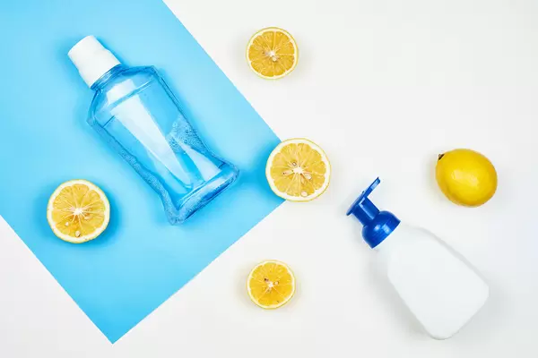 White cosmetic bottle containers based on lemon on colorful background