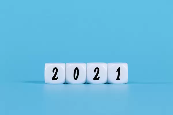White cubes with 2021 text on blue background