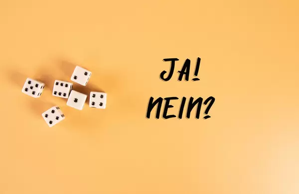 White dices with Ja! and Nein? text on orange background
