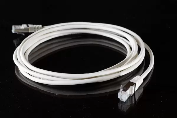White internet cable on black background (Flip 2019)