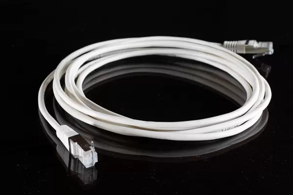 White internet cable on black background