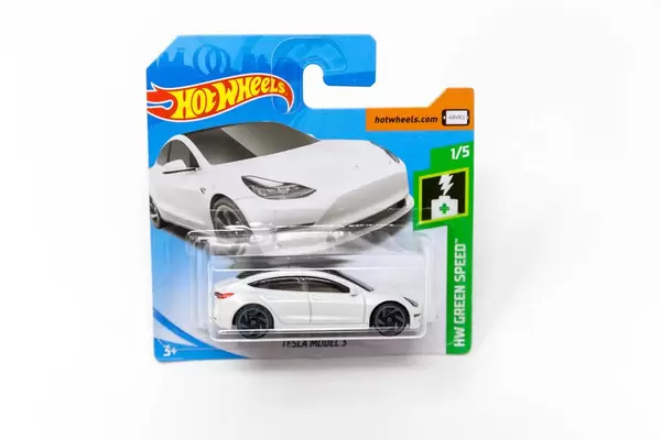 White miniatur Tesla toy car by Hot Wheels (Mattel) of the HW Green Speed Collection,  brand new and boxed, in front of white background