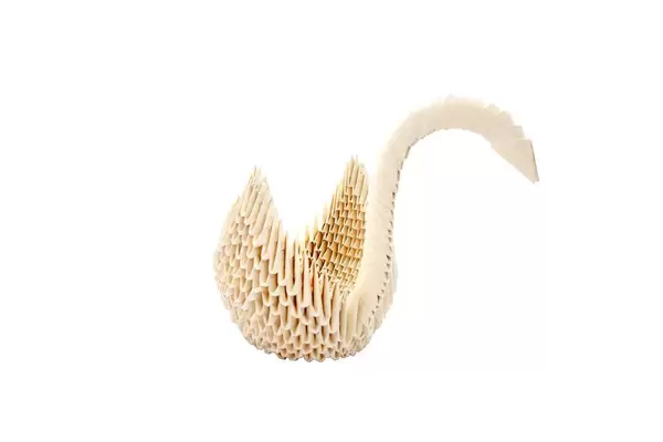 White origami swan isolated on white background