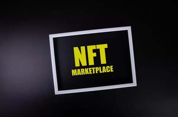 White picture frame with NFT Marketplace text on black