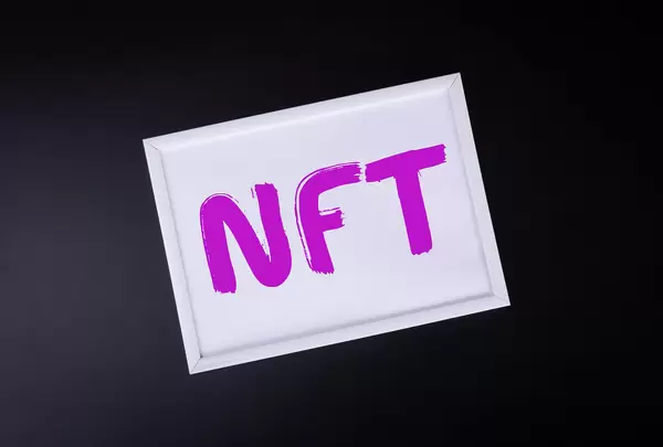 White picture frame with NFT text