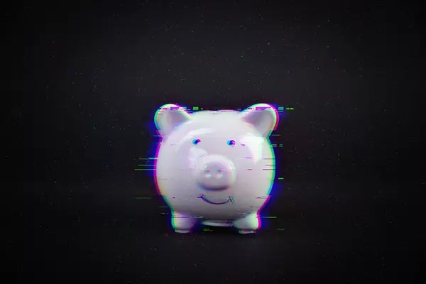 White piggybank with glitch effect on black background