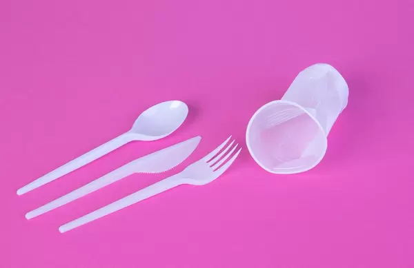 White plastic products on pink background