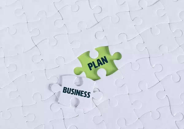 White puzzle with word Business & Plan