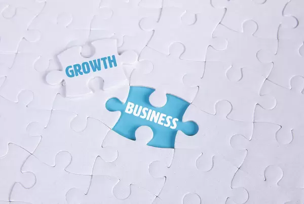 White puzzle with word Growth & Business