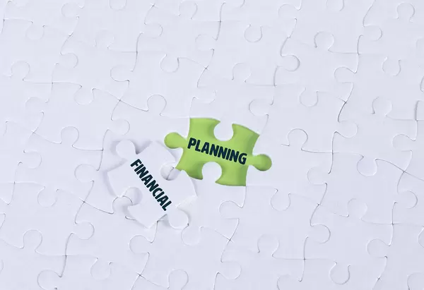 White puzzle with word Planning & Financial