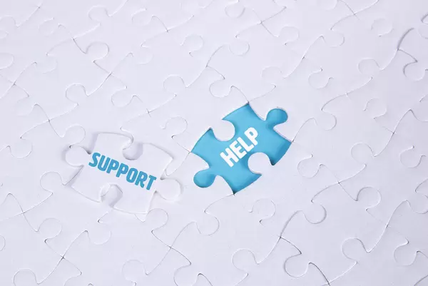 White puzzle with word Support & Help