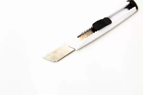 White small utility knife on white background  Flip 2019