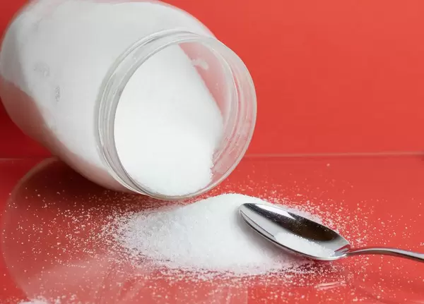 White sugar with spoon