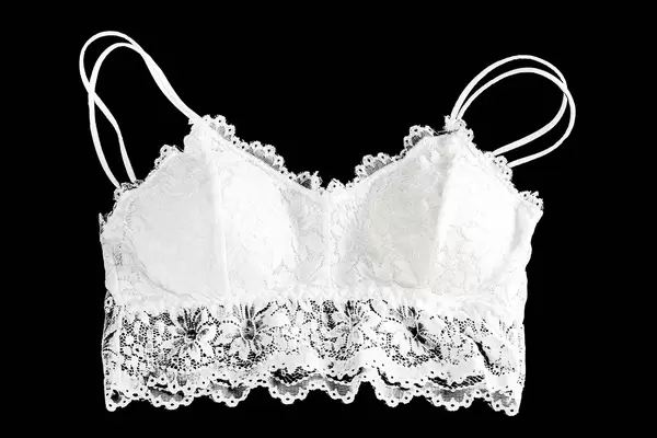 White women's bra with lace on a black background