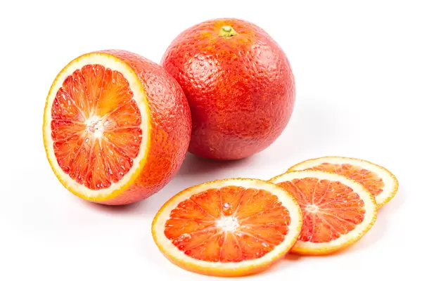 Whole and sliced ripe sicilian oranges