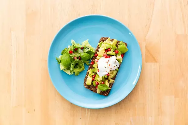 Whole Grain Bread with Avocado, Pomegranate and soy creame