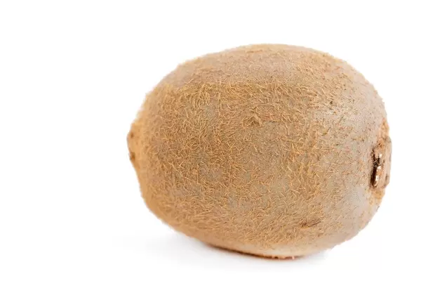 Whole Kiwi isolated above white background