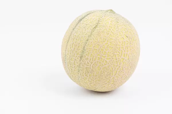 Whole Melon isolated above white background