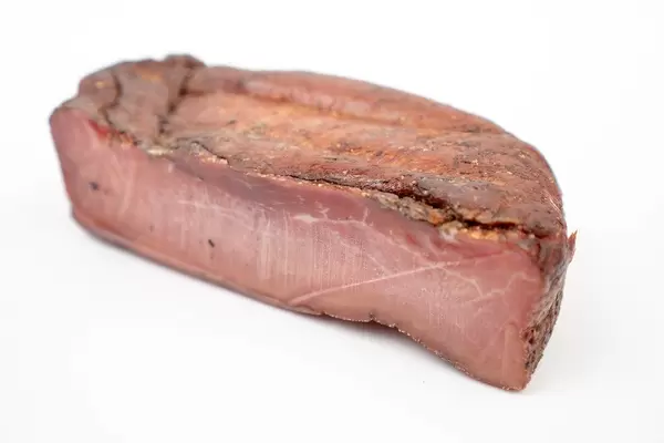Whole-piece-of-Smoked-Ham-isolated-above-white-background.jpg