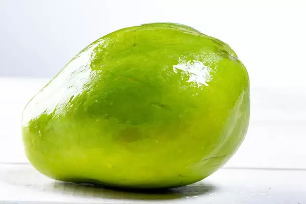 Whole ripe papaya fruit on white background