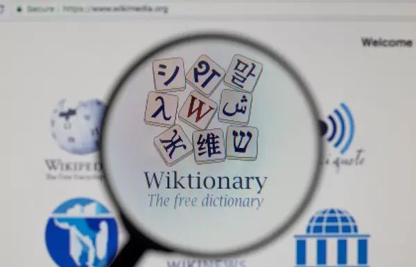 Wiktionary logo on a computer screen with a magnifying glass