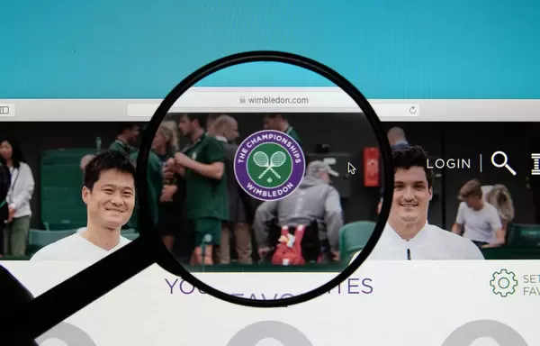 Wimbledon logo on a computer screen with a magnifying glass